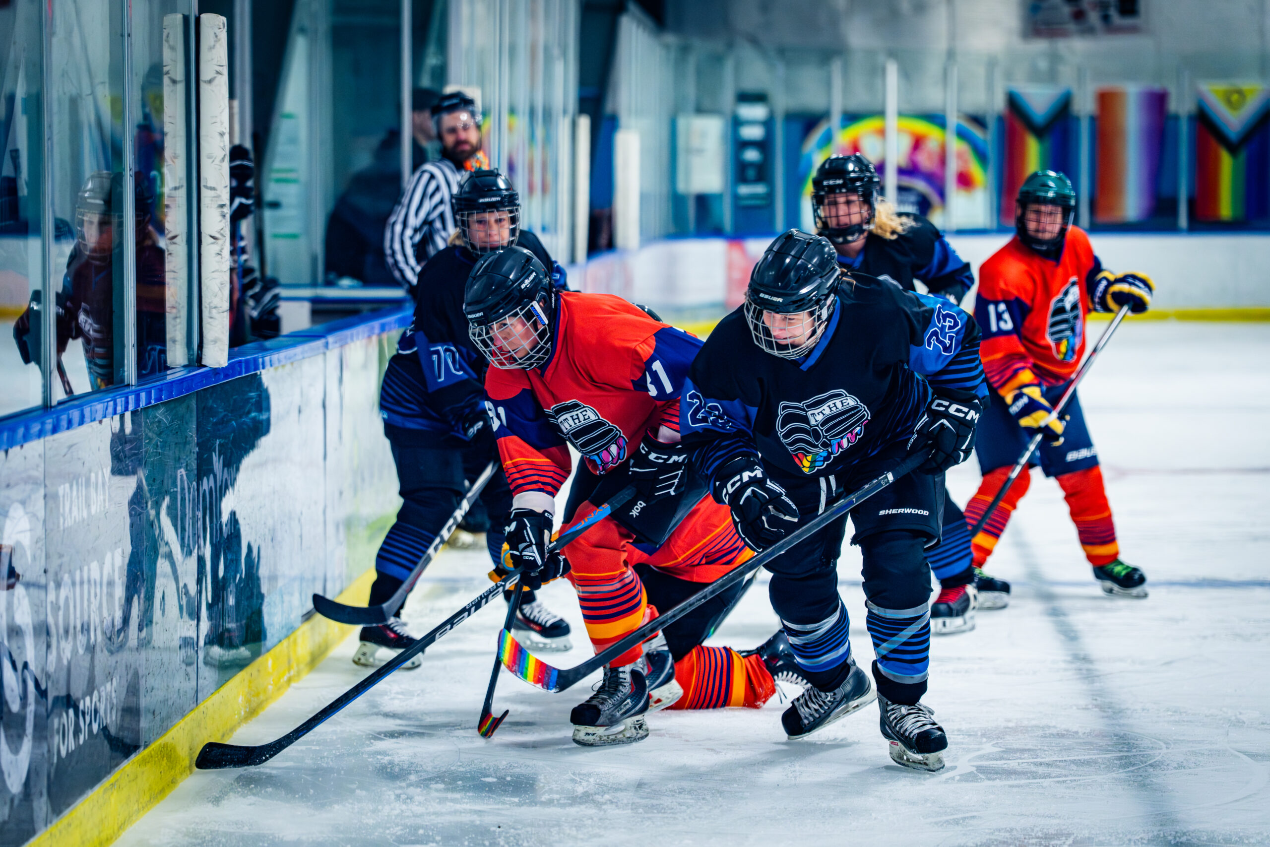 Hockey players skating in game action